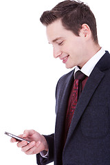 Image showing business man reading an SMS