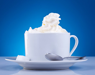 Image showing coffee and cream on blue background