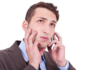 Image showing contemplative businessman talking on phone