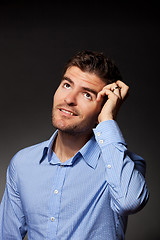 Image showing casual young pensive businessman