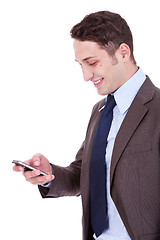 Image showing happy business man reading an SMS