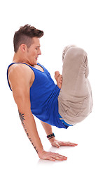 Image showing man standing on his hands in a yoga position