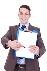 Image showing business man showing blank clipboard