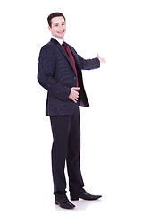 Image showing man in black suit making presentation 