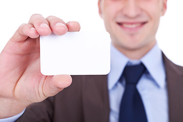 Image showing business man holding a blank card 