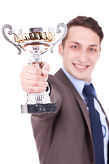 Image showing business man handing a trophy 