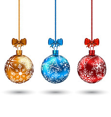 Image showing Christmas multicolor balls with bows isolated on white backgroun