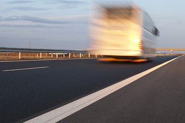 Image showing Bus traveling on highway. Motion blur effect