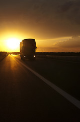 Image showing Truck traveling at sunset