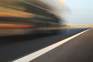 Image showing Bus traveling on highway. Motion blur effect