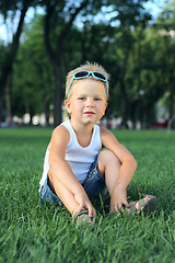 Image showing Little boy sitting in the park