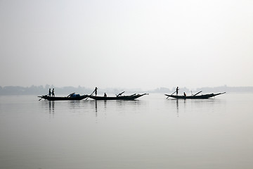 Image showing Some fishermen on a boat in Sunerband, India