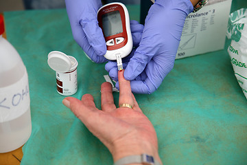 Image showing Measuring glucose level blood test