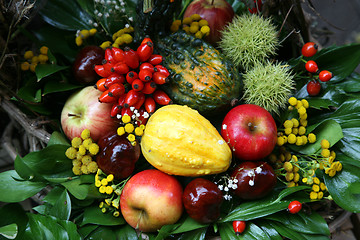 Image showing Fall arrangement with fruits and flowers