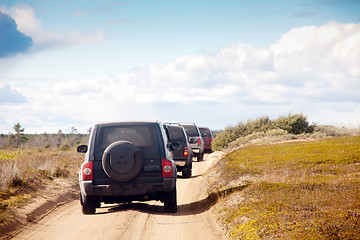 Image showing big four-wheel cars in a row