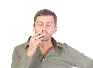 Image showing Satisfied man smoking