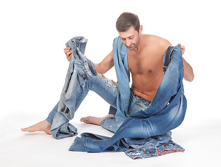 Image showing Man deciding what to wear