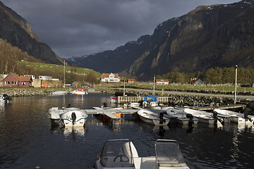 Image showing small harbor with mountains in background