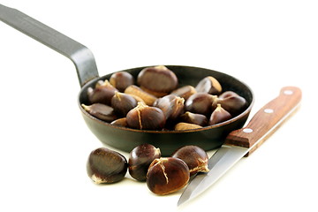 Image showing Knife and the chestnuts in a pan.