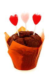 Image showing Chocolate cake and candles in the shape of heart. 