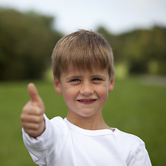 Image showing Young boy showing thumbs up