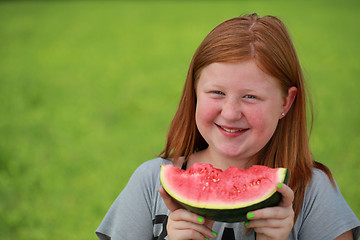 Image showing Girl eating a watermelon