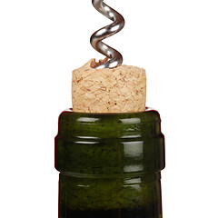 Image showing Opening a wine bottle with a corkscrew