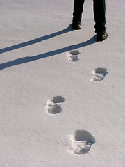 Image showing Man legs and footprints on the snow