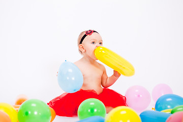 Image showing cute little baby child with colorfull balloons birthday