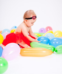 Image showing cute little baby child with colorfull balloons birthday