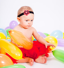 Image showing cute little baby child with colorfull balloons birthday