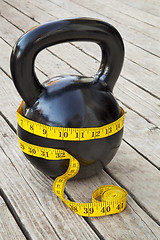 Image showing kettlebell and measuring tape