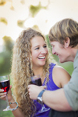 Image showing An Attractive Couple Enjoying A Glass Of Wine in the Park