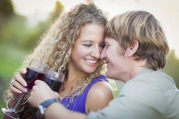 Image showing An Attractive Couple Enjoying A Glass Of Wine in the Park