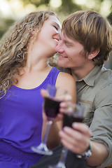 Image showing An Attractive Couple Enjoying A Glass Of Wine in the Park