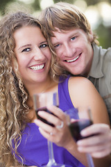 Image showing An Attractive Couple Enjoying A Glass Of Wine in the Park