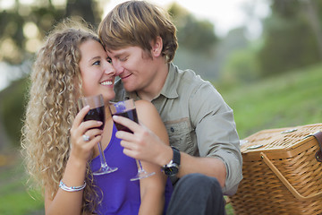 Image showing An Attractive Couple Enjoying A Glass Of Wine in the Park