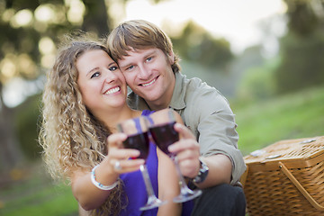 Image showing An Attractive Couple Enjoying A Glass Of Wine in the Park