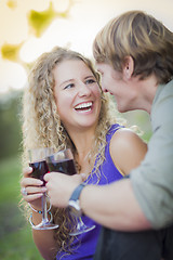 Image showing An Attractive Couple Enjoying A Glass Of Wine in the Park