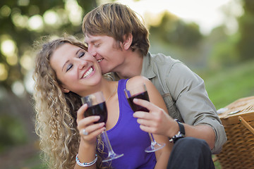 Image showing An Attractive Couple Enjoying A Glass Of Wine in the Park