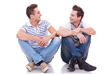 Image showing two friends smiling to each other 