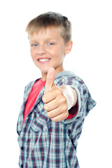 Image showing Adorable young caucasian boy showing thumbs up sign