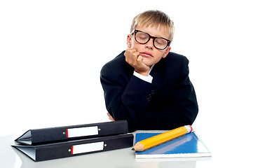 Image showing School boy in glasses dozing off