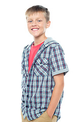 Image showing Profile shot of smart young boy posing casually