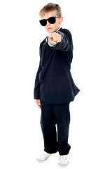 Image showing Small boy in blue suit pointing at you