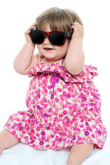 Image showing Cute little toddler wearing classy shades