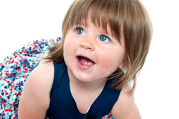 Image showing Closeup shot of blonde cute baby girl crawling