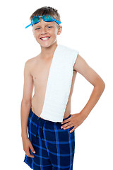 Image showing Happy 13 years old boy with goggles and towel