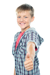 Image showing Handsome young boy gesturing thumbs up sign