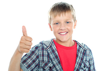 Image showing Boy in trendy clothes showing thumbs up sign